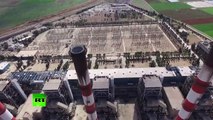 Drone flies over Aleppo thermal power plant recently retaken from ISIS