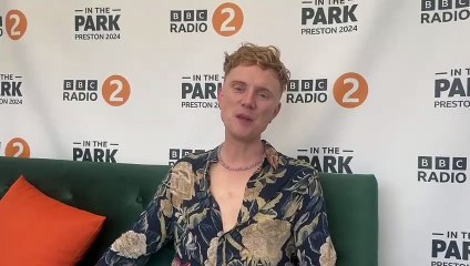 Owain Wyn Evans talks to celebrity reporter Aimee Seddon at BBC Radio 2 in the Park in Preston