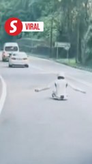 Police search for individual riding street luge board in Penang