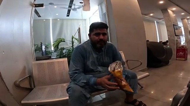 Fat boy eating chips lays