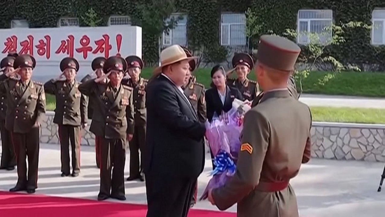 Kim Jong-un sports large cowboy hat while announcing new plan for bigger warships and submarines