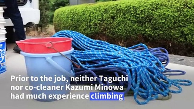 Japanese climbers clean world's tallest bronze Buddha