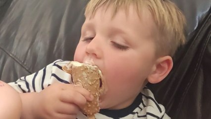 Sleepy toddler can't wait to eat ice cream despite being half asleep