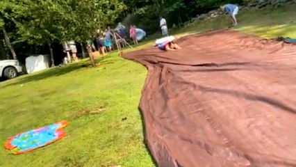 Caring aunt's birthday party slip-and-slide demonstration turns into a hilarious face-plant fail