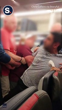 Dramatic Moment Unruly Passenger Thrown off American Airlines Flight_