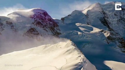 Download Video: #VIDEO: Este fotógrafo logra capturar en dron la sensación que se siente al alcanzar la cima nevada de una montaña en Suiza