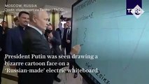 Putin dibuja una extraña cara sonriente en una pizarra eléctrica en Moscú