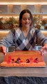 Rosalia con el pastelero Cedric Grolet haciendo la tarta de cumpleaños que luego repartió con fans en París