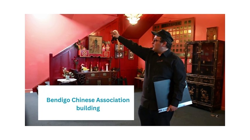 In the leadup to the traditional Good Friday walking tours, Golden Dragon Museum researcher and tour guide Leigh McKinnon shows off the Bendigo Chinese Association building Elders room.