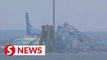 Six presumed dead after crippled cargo ship knocks down Baltimore bridge
