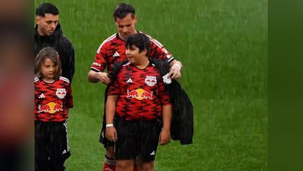 New York Red Bulls players give coats to young mascots during torrential rain in heartwarming moment