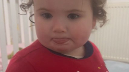 Snug as a bug: Toy baby decides to play hide-and-seek in baby girl's t-shirt