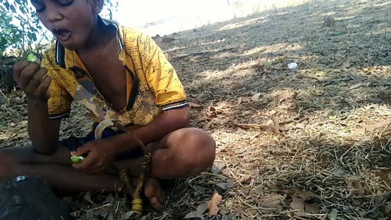 Eating yummy mango with spices.