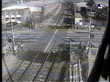 Reckless driver speeds across train tracks