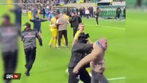 WATCH: Oleksandr Zinchenko intervenes when guard stops fan rushing the field