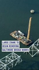 Large crane arrives to begin removing Baltimore bridge debris