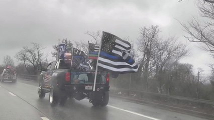 Trump posts video of cars with an image of Joe Biden hog-tied