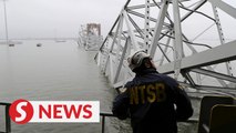 Salvage crews work to lift first piece of collapsed Baltimore bridge