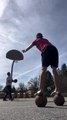 Guy Performs Basketball Trick Shots While Balancing on Basketballs