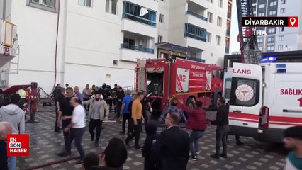 Diyarbakır'da alevler arasında kalan itfaiye eri, hortumuna tutunarak inerken düştü