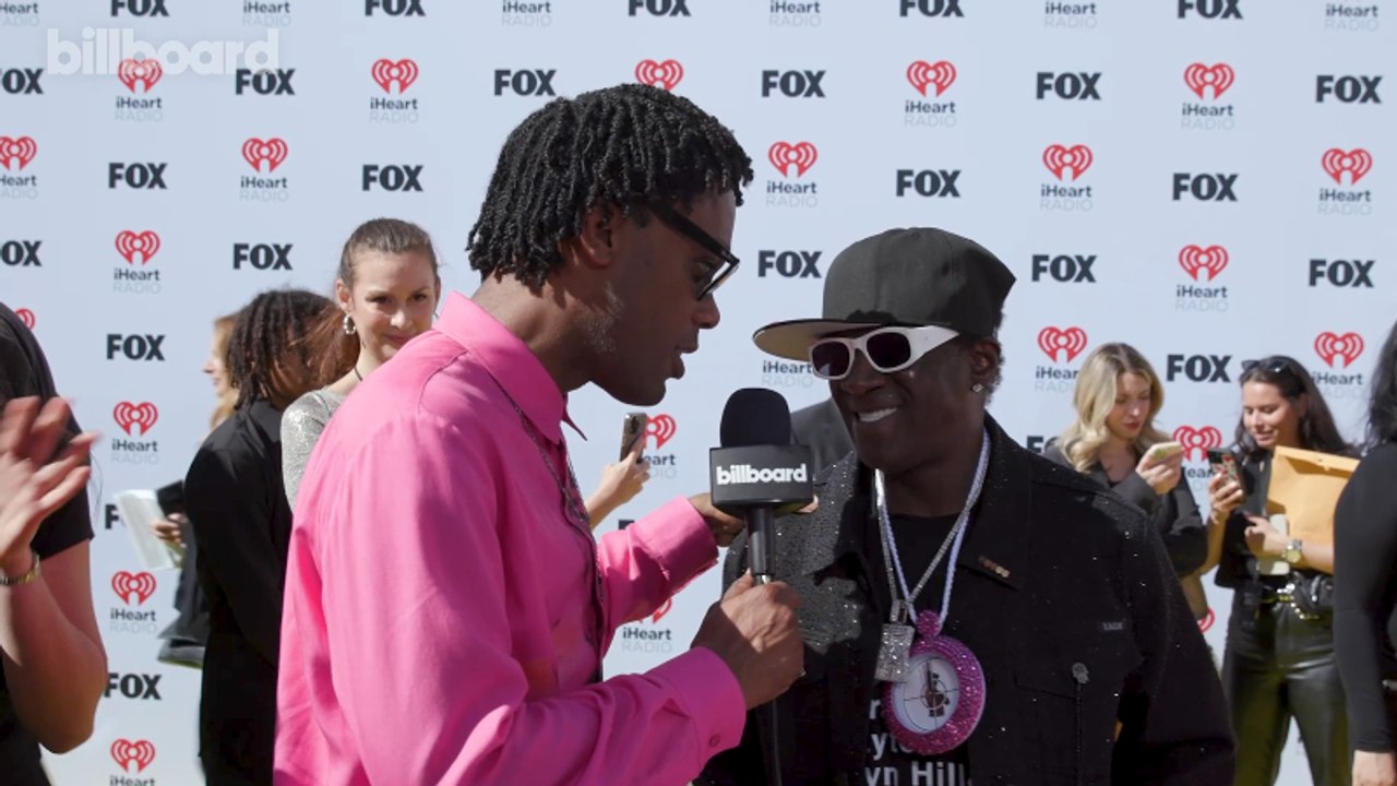 Flavor Flav Talks Taylor Swift's 'The Tortured Poets Department,' Shouts Out Beyoncé & More | iHeart Radio Music Awards 2024