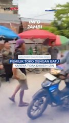Kang Parkir ngamuk dan ancam pemilik toko dengan batu karena tidak dikasih izin