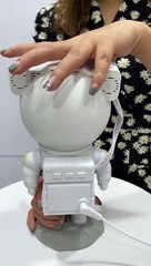 Illuminate your dreamscape with our sleek and practical space traveler's bedside lamp!