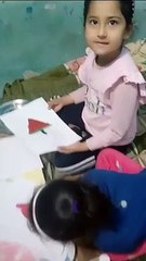Akshu and Trishu creating drawing of watermelon