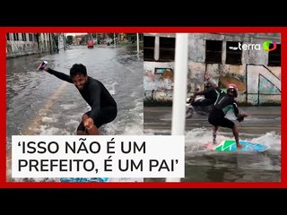 Homem surfa em ruas alagadas de Salvador e provoca prefeito