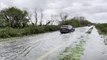 Cars drive through flooded West Sussex roads as Storm Kathleen bursts banks of River Arun