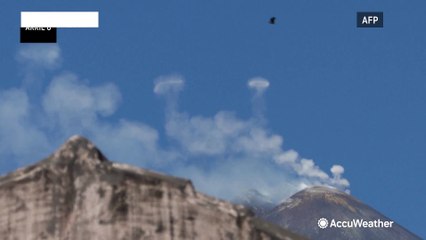 Mount Etna puffs smoke rings in sky