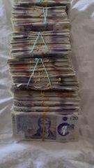 Benefit fraud gang shower floor with £20 notes