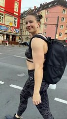 "A girl is showing off her muscles."