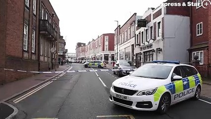 Police at the scene of a stabbing in New Street, Dudley.