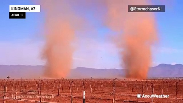 Dust devils roll down Arizona highway