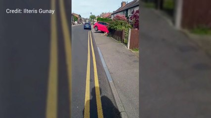 Car ploughs through wall in residential street