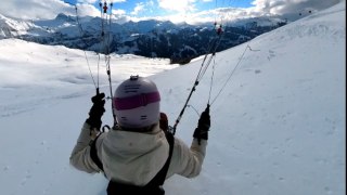 Daring woman goes 'low & fast' during incredible parakite adventure in the Swiss Alps!