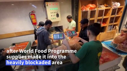 Palestinians wait for hours outside reopened bakery in Gaza City