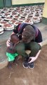 Young Man Compassionate Gesture Towards a Struggling Baby