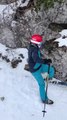 Person Tumbles and Falls While Skiing
