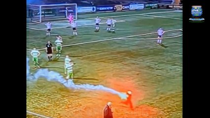 Play is halted after a child carrying a FLARE runs across the pitch during a League of Ireland clash