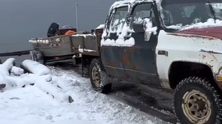 Truck Rolls Backwards on Snow Covered Ramp While Trying to Get Boat Out of Water in Canada