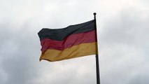 mixkit-germany-waving-flag-moved-by-the-wind-low-view-26888-medium (1)