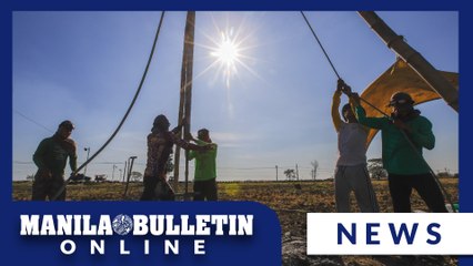 Farmers endure the high heat in making deep well irrigation