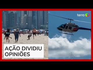 Helicóptero faz ‘chover’ dinheiro em praia de Santa Catarina