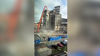 Dramatic footage captures collapse of old Royal Liverpool Hospital tower as people walk past