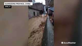 Scary moment car in China is swept away by raging floodwaters