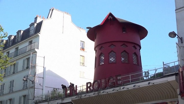 Watch: Moulin Rouge windmill blades lie in street after falling off overnight