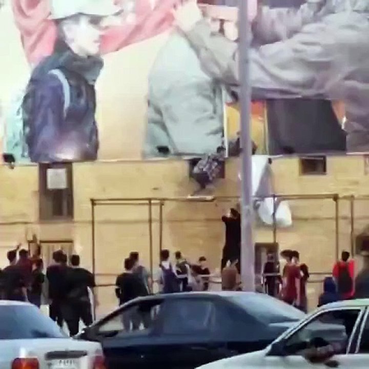 People of Iran are tearing banners showing anger over the rule of former General Qasim Suleimani