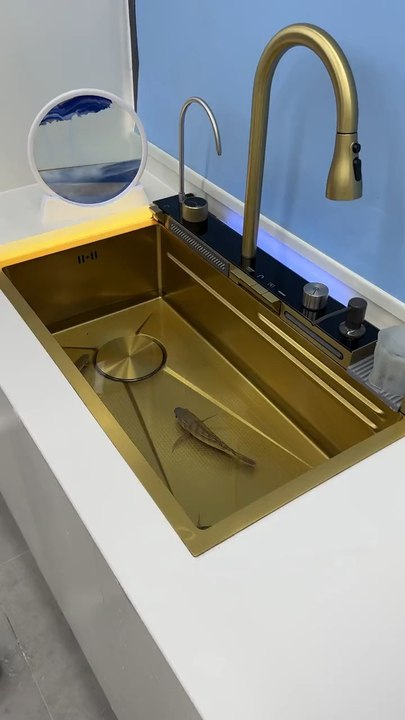 Upgrade your kitchen with this sleek waterfall sink for a touch of modern luxury.  #kitchensink #waterfalldesign #modernsink #kitchendesign #luxurykitchen #homedecor #interiorinspo #elegantstyle #instahome #instadecor